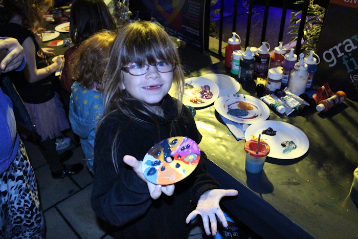 One proud kid shows her take on Isaac Newton's colour wheel painted onto a recycled CD