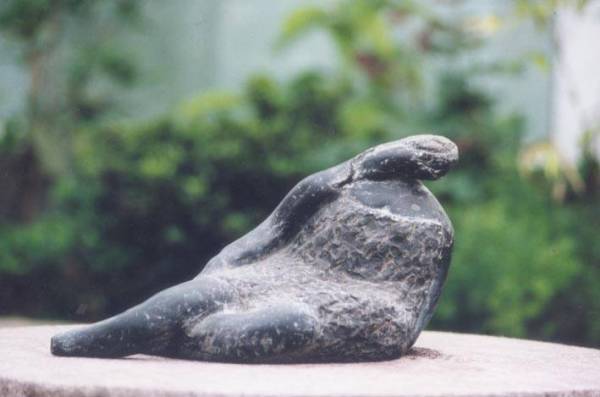 Sitting Woman sculpture - shown here in stone