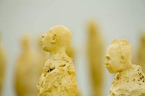 A close-up view of these small statues in sculpture installation