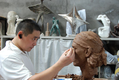 Sculptor Shen Xiaonan working on Rafael Nadal's bust in clay - to be cast in resin later and mounted onto its own Tennis Terracotta Warrior body